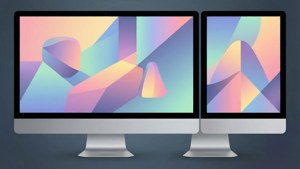 兩部 iMac 顯示帶有粉彩漸變的彩色抽象幾何壁紙。