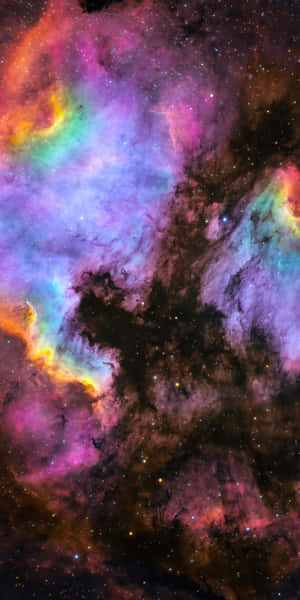 色彩繽紛的宇宙星雲，在深空中散發著發光的氣體和散落的星星。 — 月色夜空 壁紙