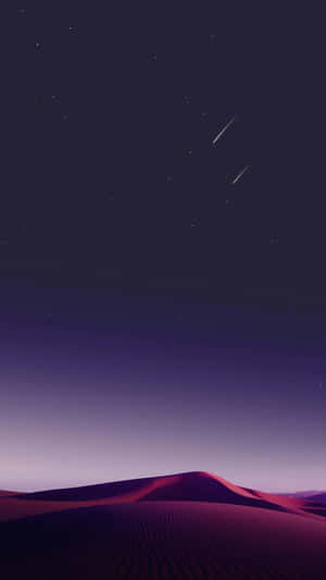 繁星夜空下的紫色沙丘與兩顆流星。