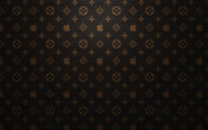 黑色背景上帶有重複金色 Louis Vuitton 和 Apple 標誌的牆紙。