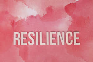粉紅色水彩背景上白色字體的「resilience」一詞。