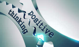 相互嚙合的齒輪，標有 thinking 和 positive，連接處發出藍色光芒。