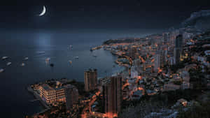 摩納哥夜景，月亮和船隻在海面上 — 夜晚 GIF 壁紙