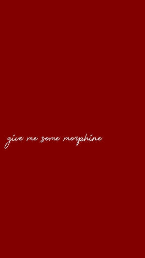 純紅色背景上的白色草書文字寫著 give me some morphine。