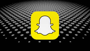 Snapchat應用程式標誌，帶有鬼魂圖示，背景為圓點