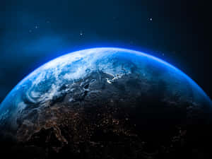 從太空看到的地球，帶有閃爍的城市燈光和星空。 — 夜晚 GIF 壁紙