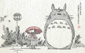 紅傘小孩與巨型龍貓在雨中巴士站旁。