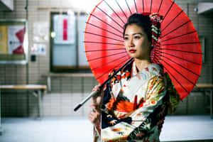 穿和服女士室內手持紅色陽傘