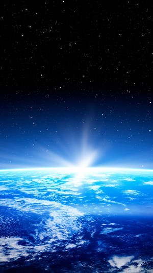 日出時從太空看到的地球，發光的藍色海洋和星空。 — 行星 壁紙