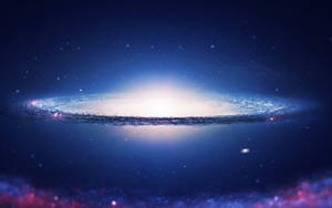 在黑暗星空背景下，一個帶有藍色和白色色調的發光螺旋星系。