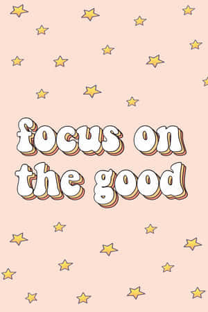 勵志短語 focus on the good 被星星環繞在粉紅色背景上。
