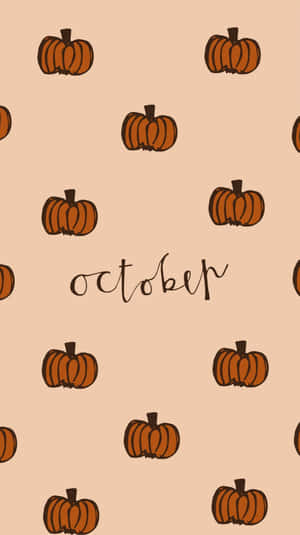 桃色背景上帶有草書體單詞october的南瓜圖案。 — 秋天 壁紙