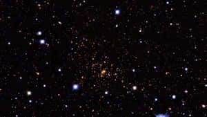 在黑暗的夜空中閃爍的廣闊星場和星系。 — 太空 壁紙