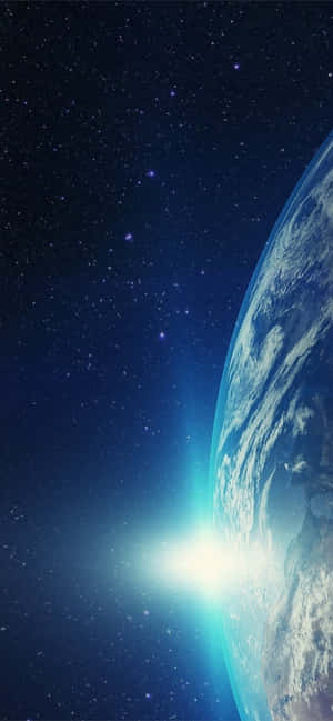 日出時從太空看到的地球，背景有星星。 — 太空 壁紙