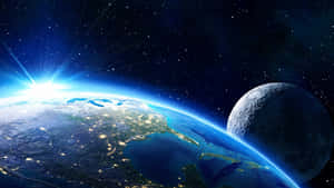 地球在日出時分城市燈光閃耀，月球旁在太空 — 太空 壁紙