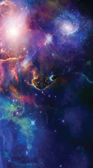 充滿活力的宇宙星雲，在深空中閃爍著星星和旋轉的彩色雲層。 — 太空 壁紙