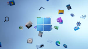 Windows 標誌被浮動應用程式圖標環繞，背景為藍色。