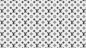 淺灰色背景上的黑白 Louis Vuitton 字母組合圖案。 — 路易威登 壁紙