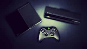 Xbox主機和控制器在黑暗表面上被聚光燈照亮。 — 4K 遊戲 壁紙