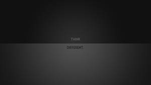 深色漸變背景，白色文字 think different 居中顯示。 — 簡約桌面壁紙
