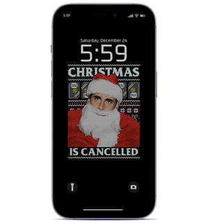手機屏幕顯示一個聖誕主題壁紙，上面有一個戴聖誕帽的男人和文字「Christmas is cancelled」。