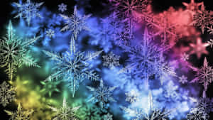 發光的霓虹雪花漂浮在色彩繽紛的漸變背景上。