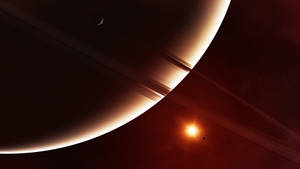 一顆巨大的環狀行星，帶有發光的邊緣和宇宙背景中的明亮恆星。 — 太陽 壁紙