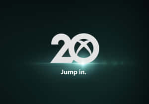 Xbox 20週年紀念標誌，帶有「Jump in.」文字，背景為深藍綠色。
