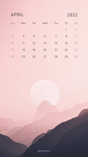 2022年4月日曆，背景為粉紅色山脈和蒼白月亮。