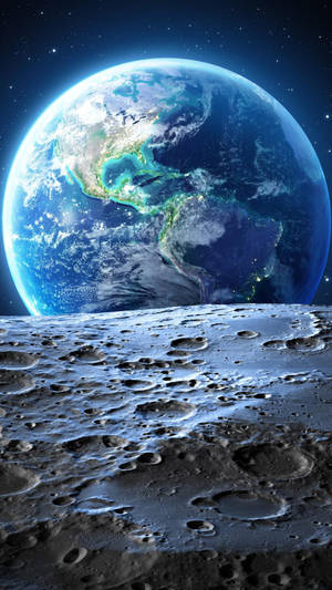 在繁星點點的夜空下，地球從月球佈滿隕石坑的表面升起。 — 月亮 壁紙