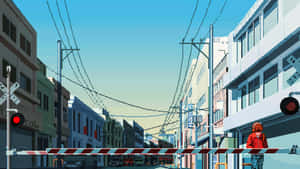 在晴朗藍天下，有鐵路平交道欄杆和紅燈的城市街道。 — 7680x4320 壁紙