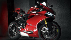 紅色Ducati 1199 Panigale運動電單車在攝影棚中，帶有戲劇性燈光。