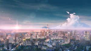 日落時分的東京天際線，東京塔被照亮，天空中有雲。
