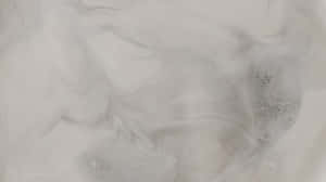 帶有斑點紋理的抽象灰色和白色漩渦圖案。 — 低對比度 壁紙
