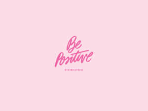 粉紅色背景，草書字體寫著「Be Positive」及「@THIMBLEPRESS」在下方。 — 勵志語錄 壁紙