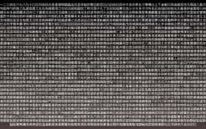 一面覆蓋著密集黑色中文字的白底牆。 — 白色美學gif 壁紙