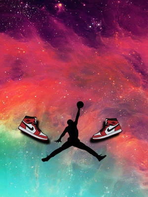 籃球運動員剪影在色彩繽紛的宇宙背景下跳躍，搭配運動鞋 — Air Jordan GIF 壁紙