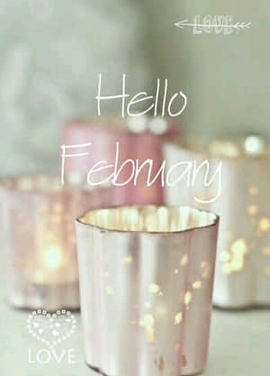 粉紅色金屬燭台，帶有發光的燈光和「Hello February」文字。 — Kindle 壁紙