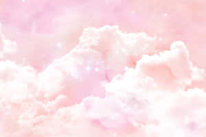 夢幻天空中柔和閃耀的星星與粉紅雲朵。 — MacBook 壁紙