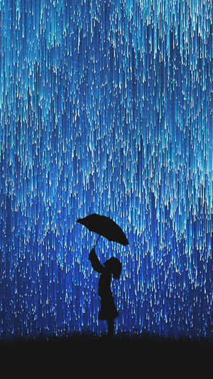 在藍色光雨下撐傘的人的剪影