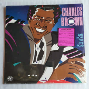 Charles Brown在彩色爵士專輯封面上微笑彈奏鋼琴。