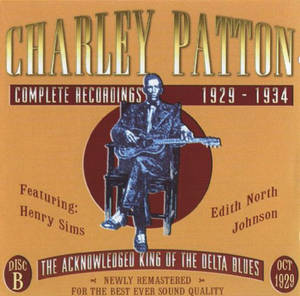 Charley Patton 在復古藍調專輯封面上坐著結他。 — Shawn Mendes GIF 壁紙