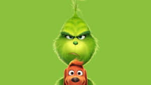 Grinch 和他的狗 Max 在綠色背景上帶著憤怒的表情。