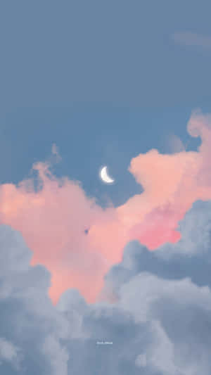 暮色中粉紅和藍色雲朵上的月牙