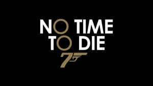 電影標題 'No Time to Die' 帶有007槍標誌在黑色背景上。
