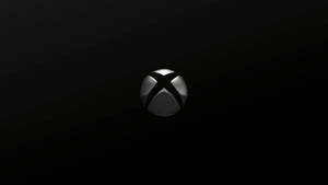 在深色漸變背景上閃亮的Xbox標誌