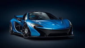 藍色McLaren P1超級跑車在攝影棚燈光下，深色背景 — 酷車 壁紙