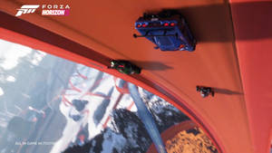 藍色賽車在 Forza Horizon 的橙色賽道上翻轉。 — 極限競速7 壁紙