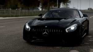 黑色Mercedes-AMG GT跑車停在路上，頭燈亮著。 — 極限競速：地平線4 壁紙