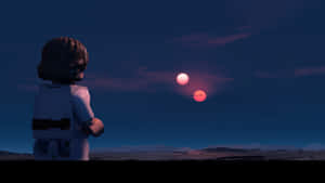 LEGO人偶觀看兩顆紅色夕陽在沙漠景觀上落下。 — 夜空 壁紙
